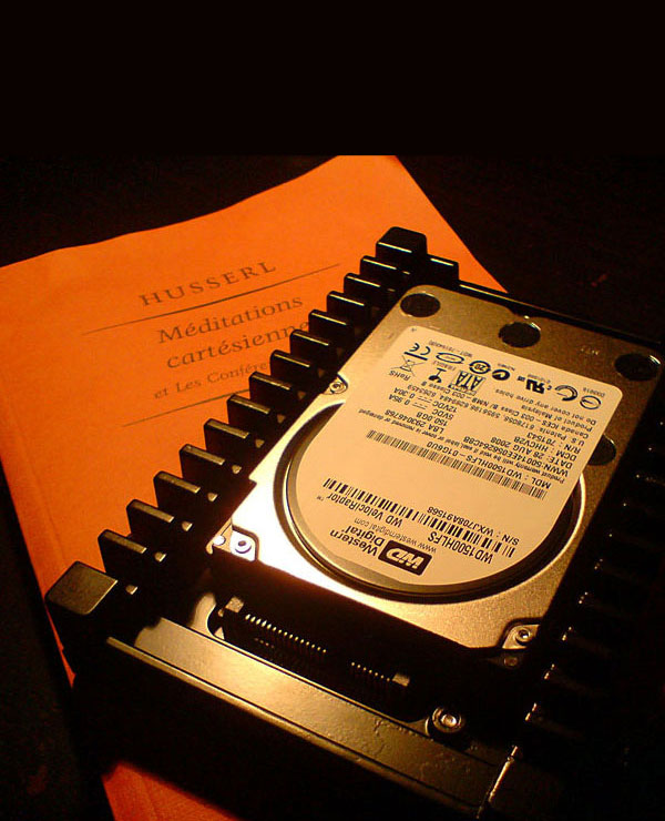 photo of a computer hard drive on a philosophy book